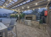 Thumbnail 37 of 49 - a patio with a grill and a table and chairs at Century HomePlace, Prattville, 36066