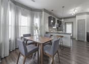Thumbnail 40 of 49 - a dining room and kitchen with a table and chairs at Century HomePlace, Alabama