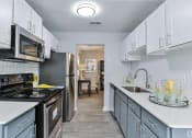 Thumbnail 12 of 19 - Galley Kitchen at SoCO Apartments at Vinings, Smyrna, Georgia