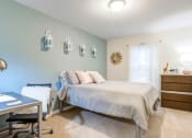 Thumbnail 23 of 31 - Bedroom with accent wall at Oasis at Twinwood in Wilmington, NC