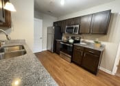 Thumbnail 19 of 26 - Townhouse kitchen at Oasis at Cedar Branch in Wilmington, NC