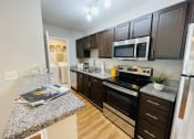 Thumbnail 13 of 26 - Modern kitchen at Oasis at Cedar Branch in Wilmington, NC