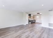 Thumbnail 14 of 34 - a spacious living room with a kitchen in the background  at The Oasis on Cascade, Atlanta, 30310
