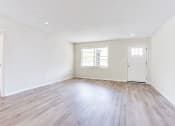 Thumbnail 15 of 34 - a bedroom with hardwood floors and white walls  at The Oasis on Cascade, Atlanta, 30310