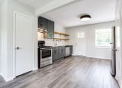 Thumbnail 16 of 34 - a kitchen with gray cabinets and stainless steel appliances  at The Oasis on Cascade, Atlanta, GA, 30310