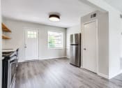 Thumbnail 18 of 34 - a kitchen and living room in a 555 waverly unit  at The Oasis on Cascade, Atlanta, GA, 30310