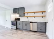 Thumbnail 12 of 34 - a kitchen with gray cabinets and white walls  at The Oasis on Cascade, Atlanta, Georgia