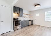 Thumbnail 24 of 34 - a kitchen with gray cabinets and stainless steel appliances  at The Oasis on Cascade, Atlanta, 30310