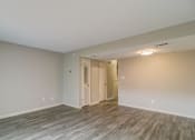 Thumbnail 20 of 29 - an empty living room with wood flooring and white walls at Savan Pointe Townhomes East and West, Savannah, GA 31406