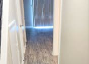 Thumbnail 25 of 29 - a hallway with a hard wood floor and a closet at Savan Pointe Townhomes East and West, Georgia