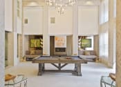 Thumbnail 16 of 22 - a large living room with a pool table and a fireplace