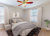 Thumbnail 12 of 22 - a bedroom with a bed and a ceiling fan