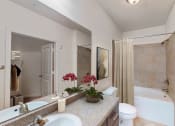 Thumbnail 19 of 22 - a bathroom with a sink and a toilet and a shower