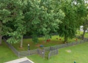 Thumbnail 28 of 53 - a backyard with trees and chickens in a fenced in area at The Dylan, Murfreesboro, TN