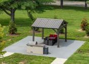Thumbnail 30 of 53 - a patio with a picnic table and a barbecue grill at The Dylan, Tennessee