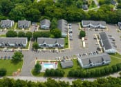 Thumbnail 31 of 53 - an aerial view of a parking lot with several buildings and a poolat The Dylan, Murfreesboro Tennessee