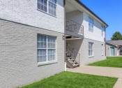 Thumbnail 43 of 53 - a side by side view of a white brick apartment building at The Dylan, Murfreesboro, TN 37129 
