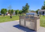 Thumbnail 34 of 53 - a stainless steel barbecue grill in the middle of a sidewalk at The Dylan, Murfreesboro, TN