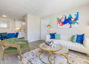 Thumbnail 5 of 53 - a living room with a couch and a table at The Dylan, Murfreesboro Tennessee