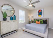 Thumbnail 11 of 53 - a bedroom with a bed and a ceiling fan at The Dylan, Murfreesboro