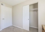 Thumbnail 45 of 53 - an empty bedroom with a closet and a door to a closet at The Dylan, Murfreesboro, 37129