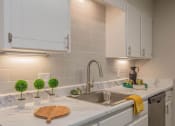 Thumbnail 2 of 53 - a kitchen with white cabinets and a sink at The Dylan, Murfreesboro 