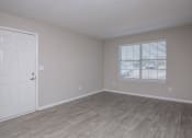 Thumbnail 47 of 53 - an empty bedroom with a door and a window at The Dylan, Murfreesboro, 37129