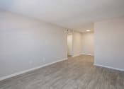 Thumbnail 49 of 53 - the living room and dining room of an empty house with wood flooring at The Dylan, Tennessee