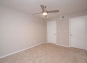 Thumbnail 52 of 53 - an empty living room with a ceiling fan and a door to a closet at The Dylan, Murfreesboro Tennessee