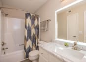Thumbnail 18 of 53 - a bathroom with a sink and a toilet and a shower at The Dylan, Murfreesboro, TN