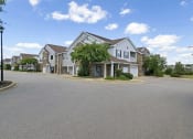 Thumbnail 3 of 49 - an empty street in front of a row of houses at Century HomePlace, Alabama