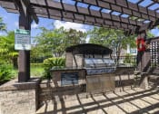 Thumbnail 4 of 49 - a grill in a park with a wooden pavilion at Century HomePlace, Alabama, 36066