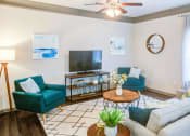Thumbnail 17 of 49 - a living room with a couch and a tv at Century HomePlace, Alabama