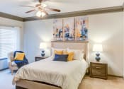 Thumbnail 28 of 49 - a bedroom with a bed and a ceiling fan at Century HomePlace, Prattville, AL