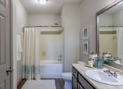 Thumbnail 34 of 49 - a bathroom with a shower and a sink and a toilet at Century HomePlace, Prattville, AL 36066