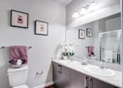 Thumbnail 37 of 38 - A bathroom with a toilet, sink, and towel rack.at Century Ariva, Lakeland, FL 33812  
