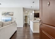 Thumbnail 6 of 48 - A living room with a couch and a painting on the wall.at Century Hampton Roads, Suffolk, 23435  