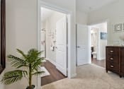 Thumbnail 20 of 48 - A white door is open to a bathroom.at Century Hampton Roads, Suffolk, VA  