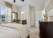 Thumbnail 24 of 48 - A bedroom with a large bed and a ceiling fan.at Century Hampton Roads, Suffolk  
