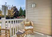 Thumbnail 26 of 48 - A patio with a chair and a table.at Century Hampton Roads, Suffolk, 23435  
