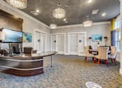 Thumbnail 34 of 48 - A reception area with a desk and chairs.at Century Hampton Roads, Suffolk  