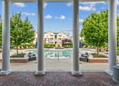 Thumbnail 42 of 48 - A view of a pool through a white column.at Century Hampton Roads, Suffolk Virginia  