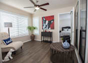 Thumbnail 17 of 24 - A living room with a white sofa and a wooden coffee table at Ridge Crossings Apartments, Alabama 35244