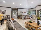 Thumbnail 4 of 24 - A living room with a grey couch and a wooden coffee table at Ridge Crossings Apartments, Alabama 35244