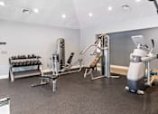 Thumbnail 14 of 24 - A gym with a variety of equipment at Ridge Crossings Apartments, Hoover, Alabama