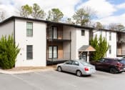 Thumbnail 7 of 35 - Exterior photo of parking lot and apartments at Parkside Sandy Springs Atlanta, GA