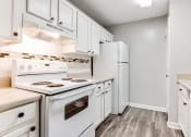 Thumbnail 19 of 35 - White appliances and white cabinets at Parkside at Sandy Springs Atlanta, GA