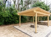 Thumbnail 3 of 35 - Fire pit and grill at Parkside Sandy Springs Atlanta, GA