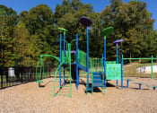 Thumbnail 28 of 49 - a playground with a blue and green swing set  at Peaks at Gainesville, Gainesville, Georgia