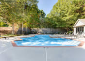 Thumbnail 26 of 49 - a pool with chairs and a house in the background  at Peaks at Gainesville, Gainesville, GA
